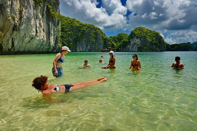 1 Day Boat Tour: HaLong Bay, Lan Ha Bay, Natural Beach and Full Moon Party - Swimming and cave exploration at the natural beach
