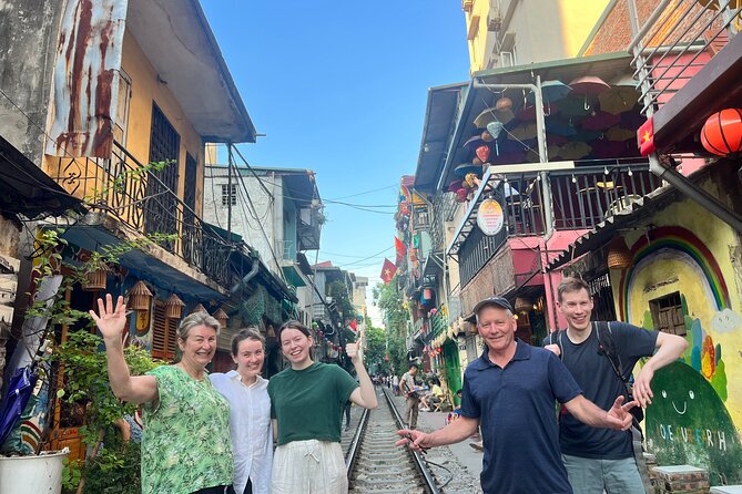 Best Hanoi Food Tour 7 Different Food Tasting Visit Train Street - Train Street, photos, and a drink beside the tracks