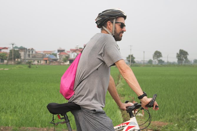 Bicycle Tour Full Day Explore Red River Delta & Rural Villages - Visiting a family home and tasting farm fruit
