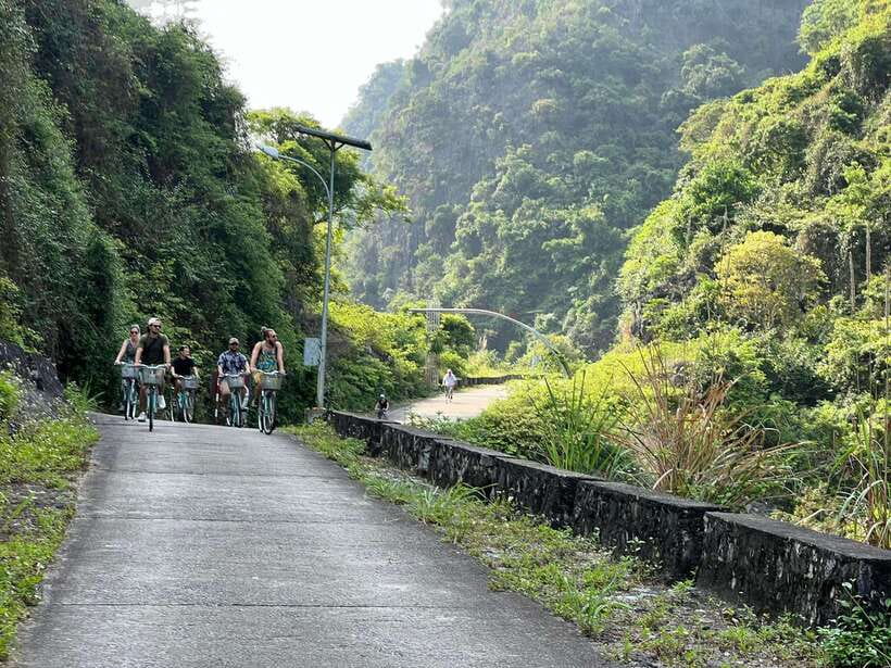 Cat Ba: Full- day trip with biking, kayaking, meal, tickets - Cruising past fishing homes and limestone islands
