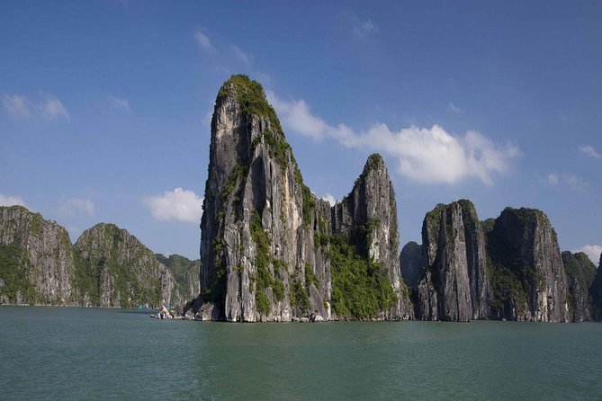 Full-Day Halong Bay Tour Including Kayaking from Hanoi - Seeing Dog Islet and the bay’s famous rock formations