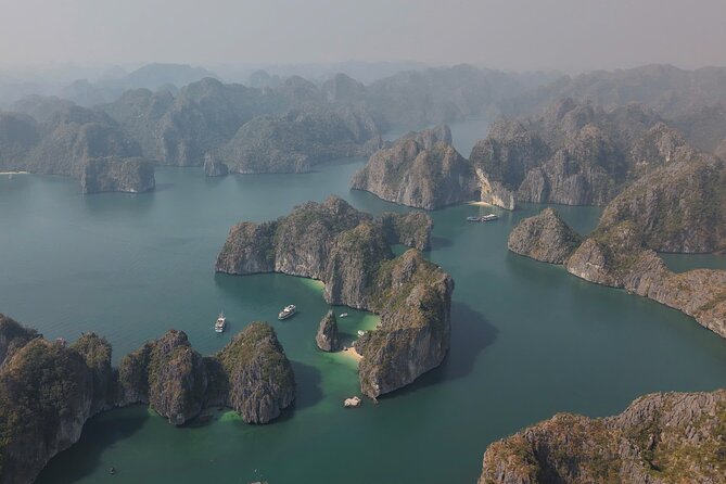 Ha Long Bay Cruise Day Tour - Cave, Kayaking, Swimming & Lunch - Kayaking or bamboo boating at Hang Luon