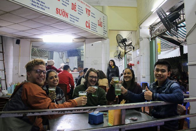 Half-Day Hanoi Food Walking Tour - Walking from the market into the Old Quarter