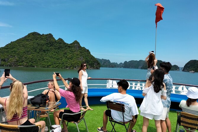 Halong Bay Day Tour With Titop Island, Cave, Kayak & Lunch - Kayaking or bamboo boating near Luon Cave
