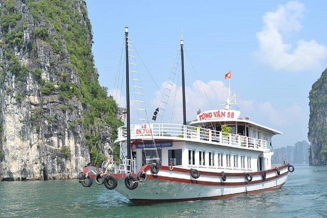 Halong Bay Islands and Caves: Full-Day Tour from Hanoi - Fighting Cocks Islet and Halong Bay’s famous silhouette