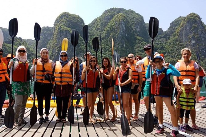 Halong Bay Islands and Caves: Full-Day Tour from Hanoi - A 40-minute bamboo boat ride through the floating village