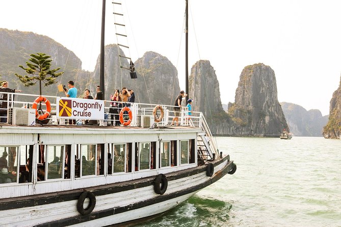 Halong Day Tour: Islands, Cave, Kayak. Lunch. Transfers - Boarding the boat and finding the bay’s famous shapes