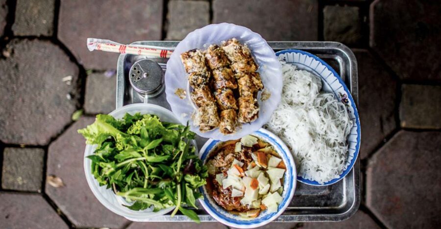 Hanoi: 7 Tastings Street Food Tour with Train Street - Vietnamese pizza, noodle salad, and grilled pork sticks