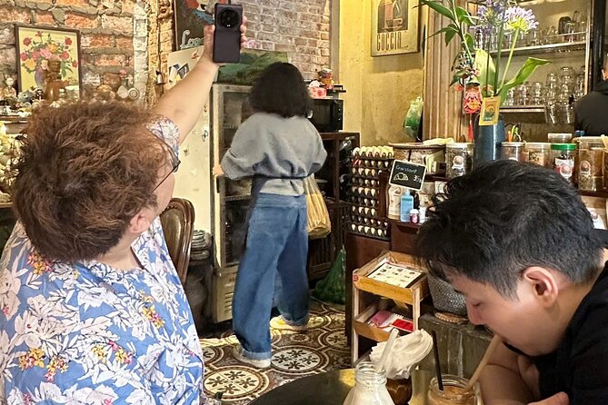 Hanoi Coffee Culture Tour: Sip, Taste & Hear Local Stories - Walking past the Opera House into the French Quarter