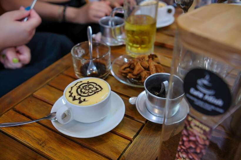 Hanoi: Cyclo the Old Quarter and Egg Coffee Tour - Egg coffee in an old cafe near the lake