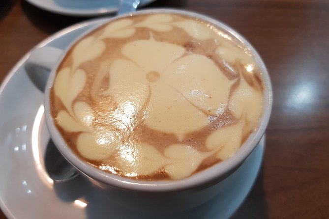 Hanoi daily egg coffee making course with local guide - Tasting the coffee with a spring roll