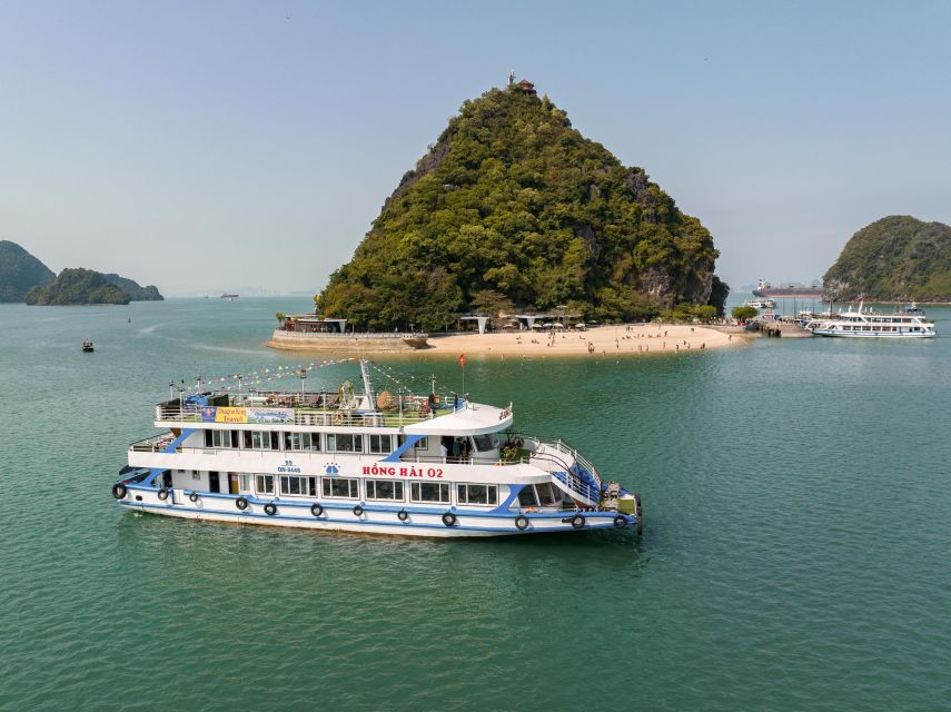 Hanoi: Halong Bay Day Trip with Titop Island, Cave, & Kayak - Titop Island, steps, beach, and the big view