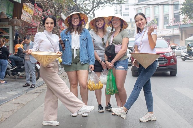 Hanoi Maya Kitchen: Traditional Cooking Class & Market Tour - Learning to roll fried spring rolls by hand