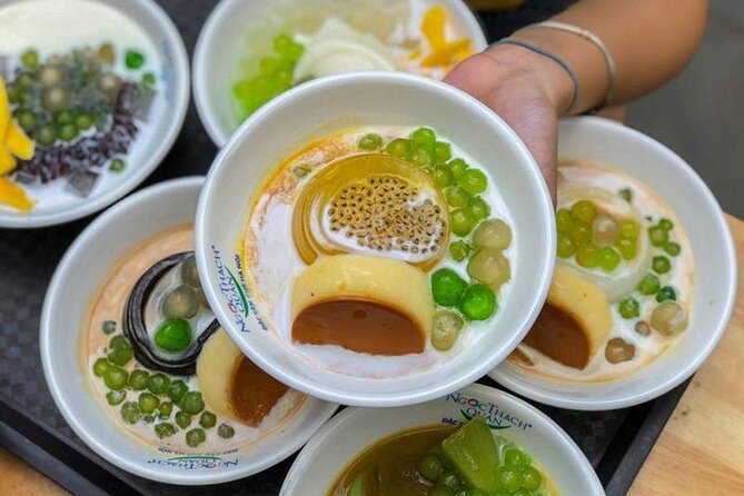 Hanoi Old Quarter Street Food tour with 12 plus tastings - Stop two: banh mi and pandan sticky rice