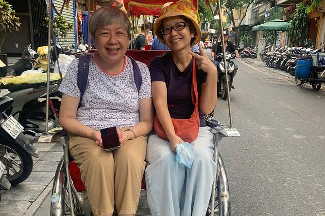 Hanoi Street Food Tour by Motorbike or Walking with Local Guide - Dong Xuan Market shows the city at working speed