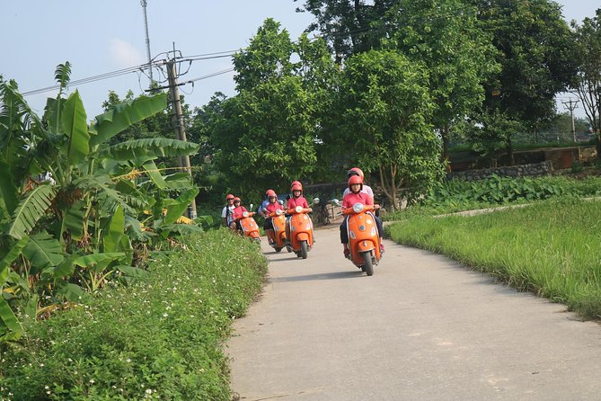 Hanoi Vespa Full Day City & Countryside with Female Ao Dai Riders - West Lake, narrow lanes, and the B52 crash site