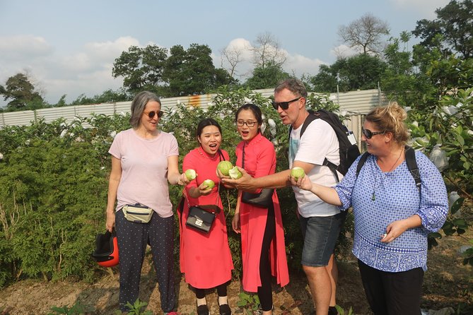 Hanoi Vespa Full Day City & Countryside with Female Ao Dai Riders - Railway tracks and everyday city life