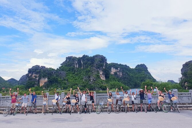 Highlight Ninh Binh Full Day Tour Tam Coc Boat, Mua Cave, Hoa Lu - Cycling through a Ninh Binh village