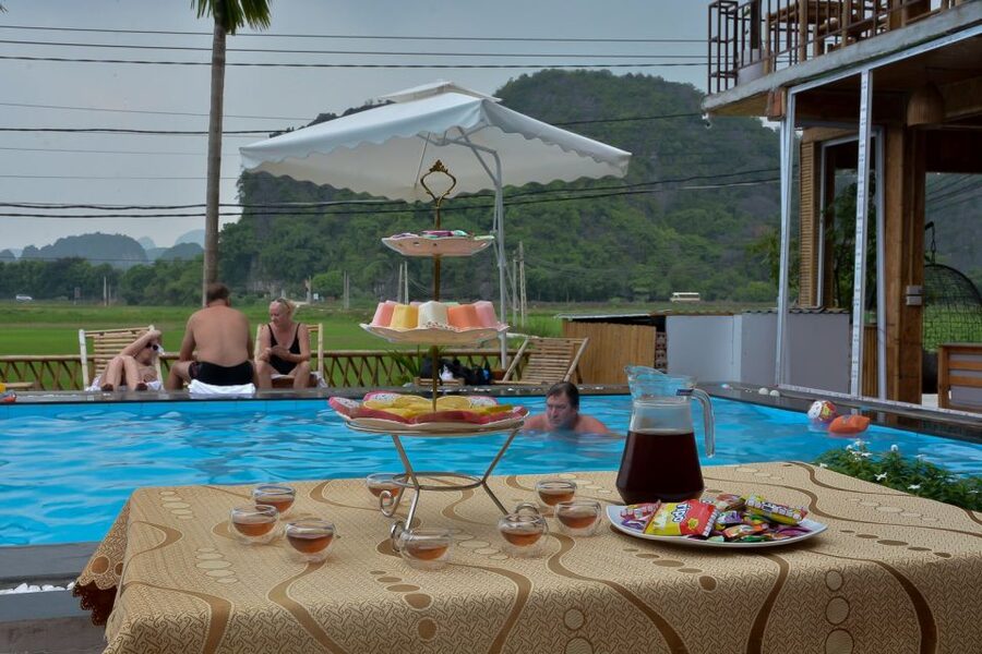 Ninh Binh Daily: Hoa Lu, Mua Cave, Tam Coc, Bike & Swimming - Lunch at the pool bungalow