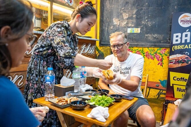 Old Quarter Food Tour in Hanoi - Long Bien Bridge and comforting rice porridge