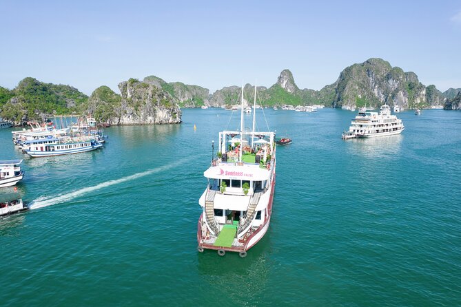 Sweetness Cruise Ha Long Bay: Caves, Kayaking, Swimming & Lunch - Sunset, music, fruit, and the upper deck